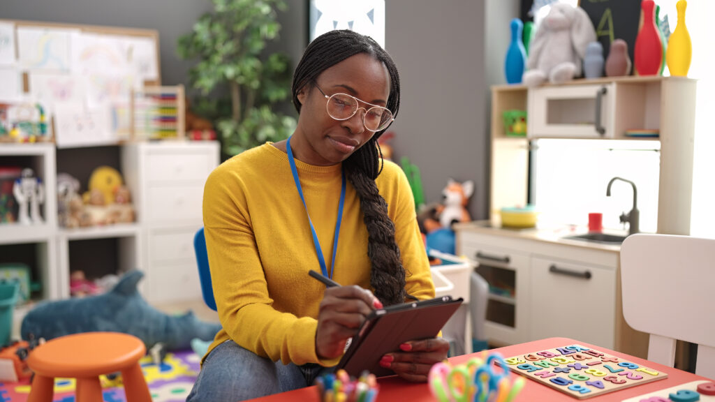 teacher with tablet